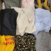 The photo shows a package with clothing in the category TSC.