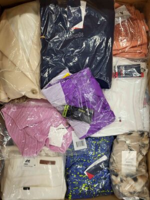 The photo shows a package with clothing in the category AW.