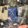 The photo shows a package with clothing in the category AW.