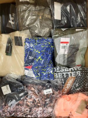 The photo shows a package with clothing in the category AW.