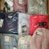 The photo shows a package with clothing in the category AW.