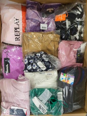 The photo shows a package with clothing in the category AW.