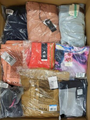 The photo shows a package with clothing in the category AW.