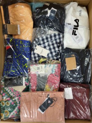 The photo shows a package with clothing in the category AW.