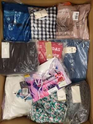 The photo shows a package with clothing in the category AW.
