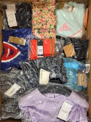 The photo shows a package with clothing in the category AW.
