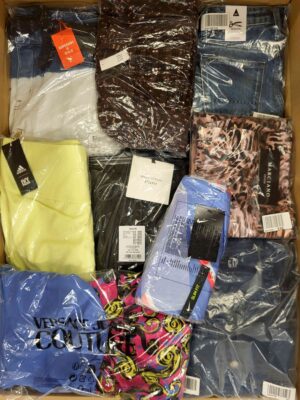 The photo shows a package with clothing in the category AW.