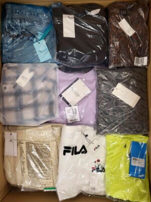 The photo shows a package with clothing in the category AW.