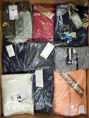 The photo shows a package with clothing in the category AW.