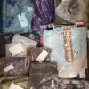 The photo shows a package with clothing in the category AW.