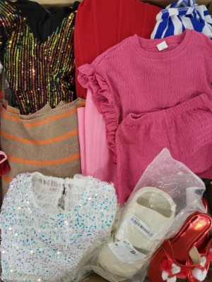 The photo shows a package with clothing in the category SN.