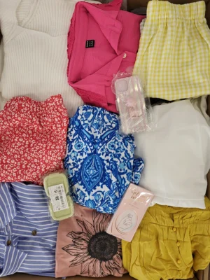 The photo shows a package with clothing in the category SN.