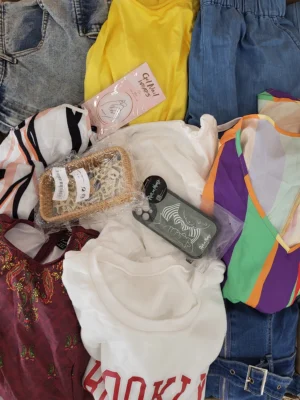 The photo shows a package with clothing in the category SN.