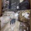 The photo shows a package with clothing in the category AP.