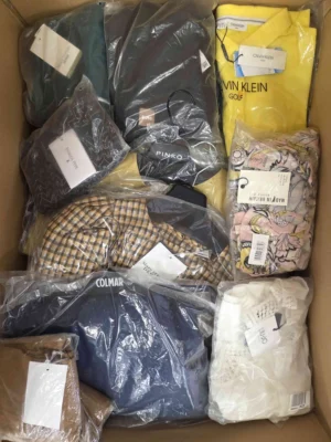 The photo shows a package with clothing in the category AP.
