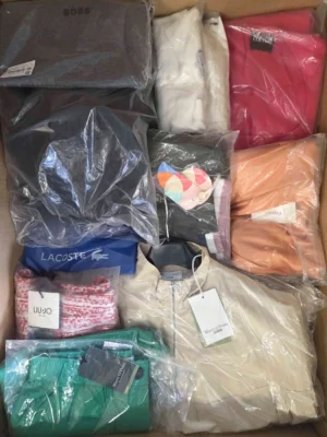 The photo shows a package with clothing in the category AP.