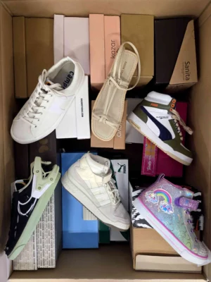 The photo shows a package with footwear in the category AS.