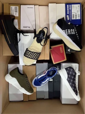 The photo shows a package with footwear in the category AS.