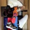 The photo shows a package with footwear in the category AS.