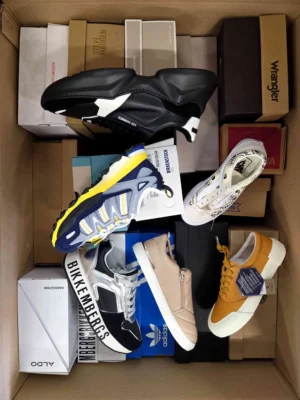 The photo shows a package with footwear in the category AS.
