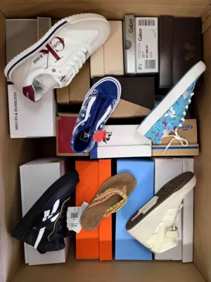 The photo shows a package with footwear in the category AS.