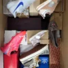 The photo shows a package with footwear in the category AS.