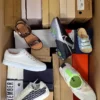 The photo shows a package with footwear in the category AS.