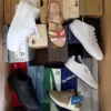 The photo shows a package with footwear in the category AS.