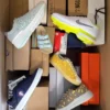 The photo shows a package with footwear in the category AS.