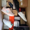 The photo shows a package with footwear in the category AS.