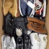 The photo shows a package with footwear in the category SH.