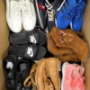 The photo shows a package with footwear in the category SH.