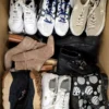 The photo shows a package with footwear in the category SH.