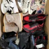 The photo shows a package with footwear in the category SH.