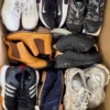 The photo shows a package with footwear in the category SH.