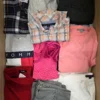 The photo shows a package with clothing in the category U.