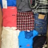 The photo shows a package with clothing in the category U.