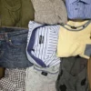 The photo shows a package with clothing in the category U.