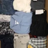 The photo shows a package with clothing in the category U.