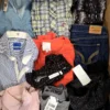 The photo shows a package with clothing in the category U.