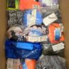 The photo shows a package with clothing in the category ABW.