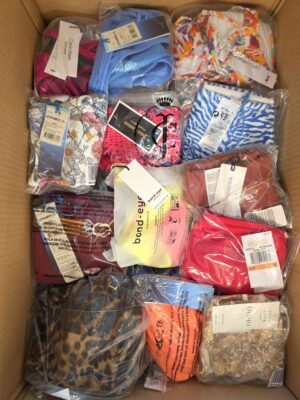 The photo shows a package with clothing in the category ABW.