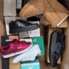 The photo shows a package with footwear in the category BS.