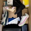 The photo shows a package with footwear in the category BS.