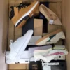 The photo shows a package with footwear in the category BS.