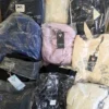 GB355 1 The photo shows a package with clothing in the category B.