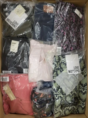 The photo shows a package with clothing in the category AW.