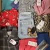 The photo shows a package with clothing in the category TSC.