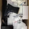 The photo shows a package with footwear in the category BS.