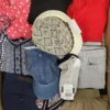 The photo shows a package with clothing in the category TSC.